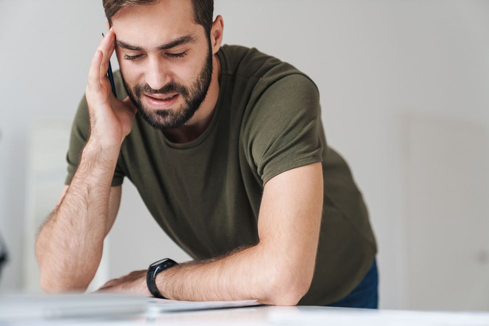 Man reads his company policy about office romances