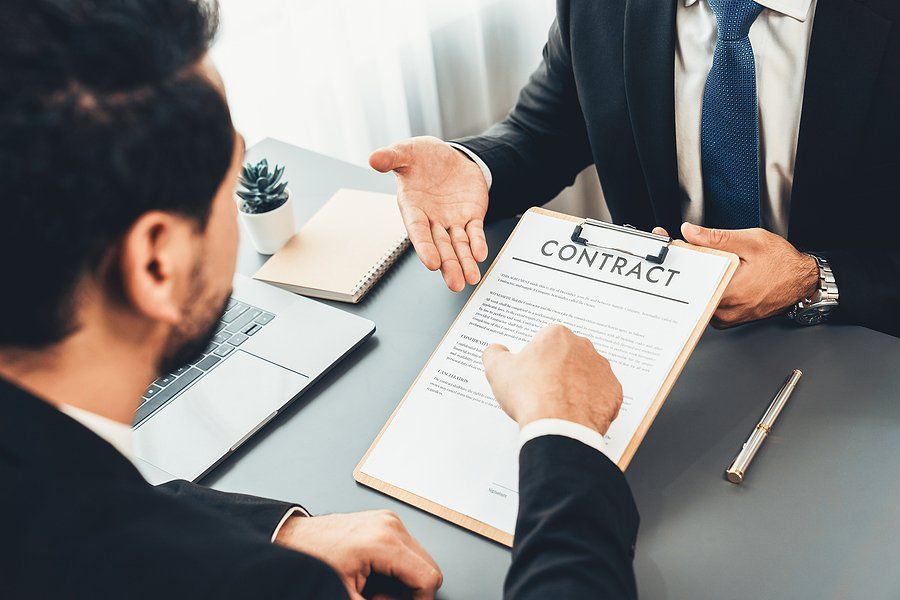 Man reads his employment contract after negotiating his salary in the job interview