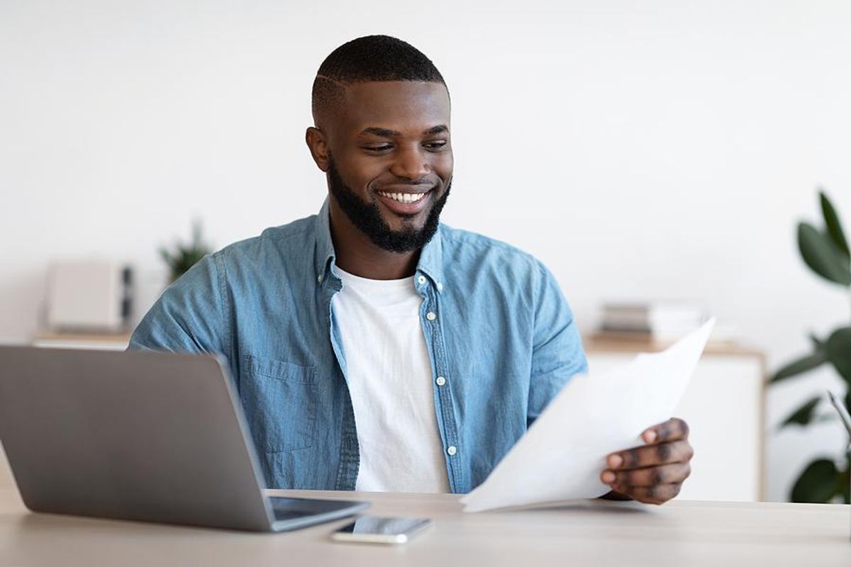 Man reads his resume with quantifiable achievements
