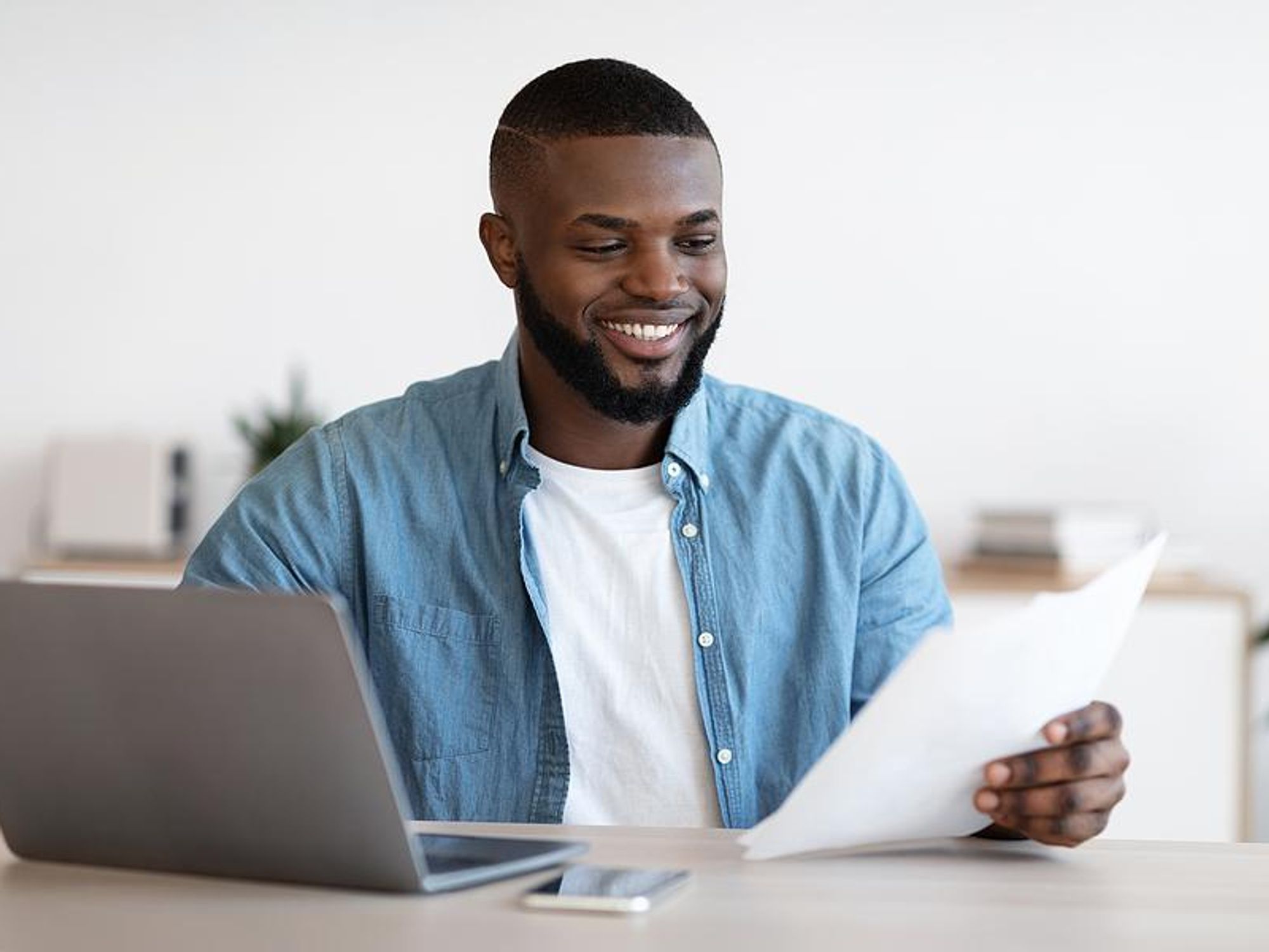 Man reads his resume with quantifiable achievements