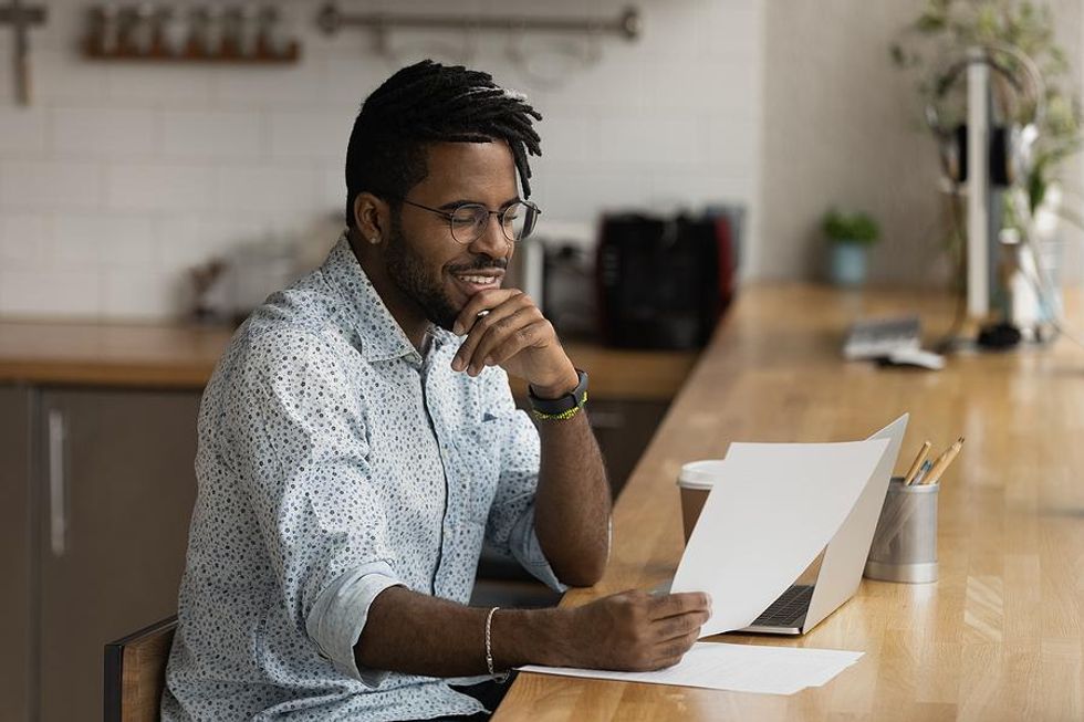 Man reads his resume