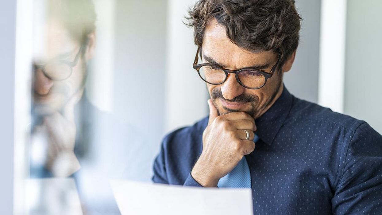 Man reads the work experience on his resume