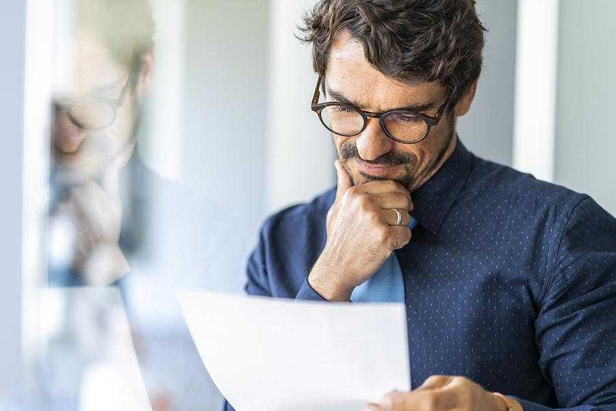 Man reads the work experience on his resume