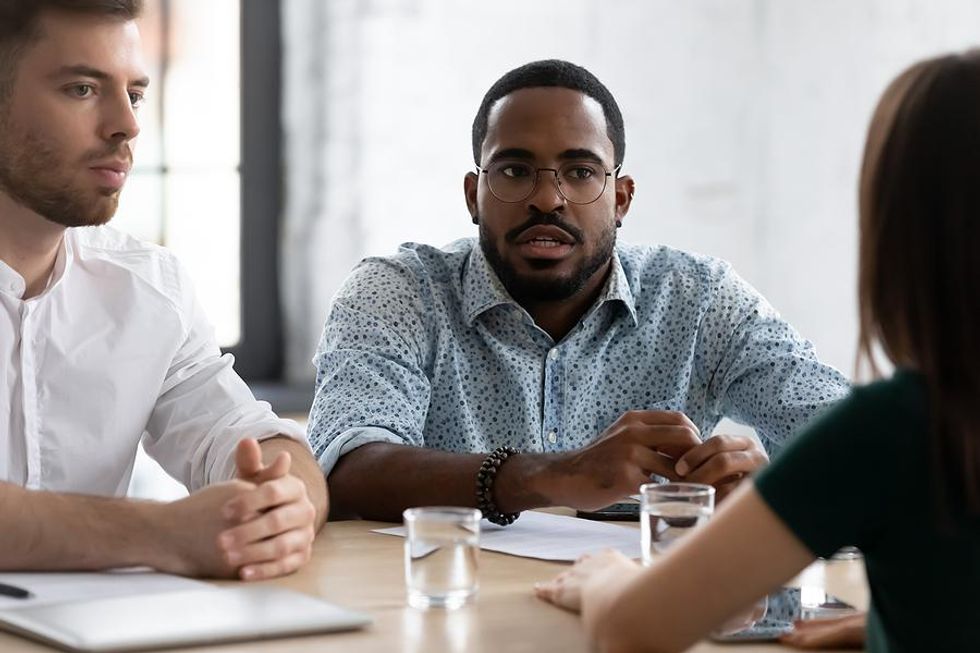 Man realizes his boss is incompetent during a work meeting