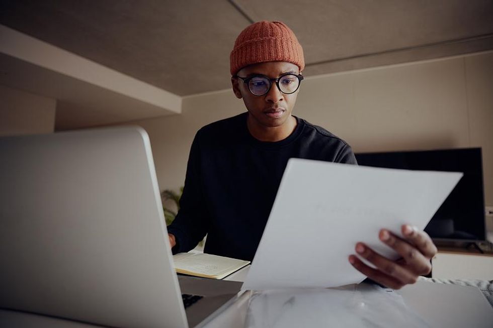 Man reviews his resume and LinkedIn profile