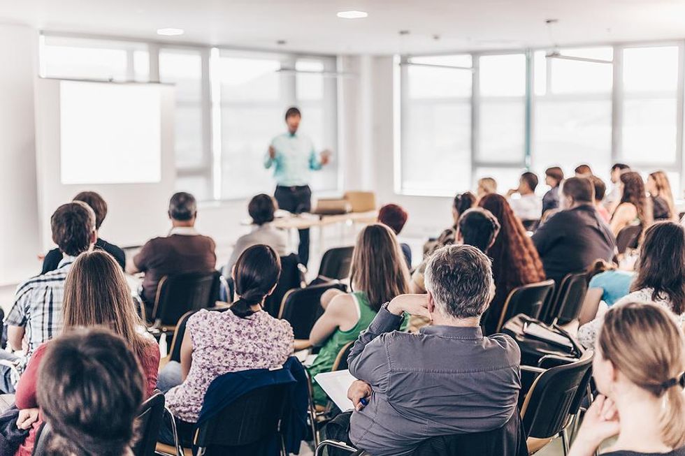 Man runs a training session at work