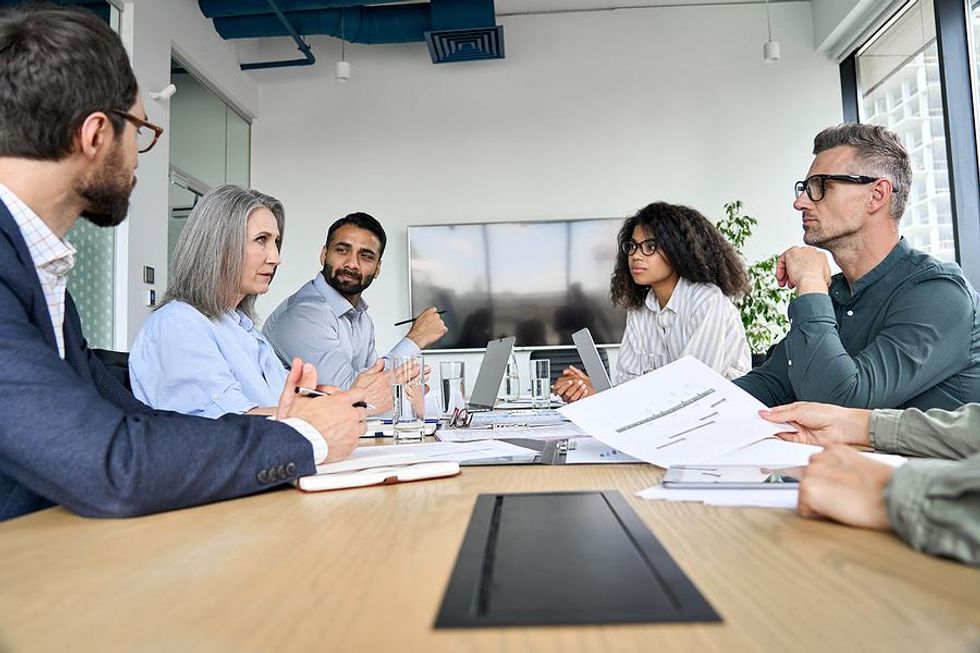 Man sets boundaries with his manager at work during a meeting