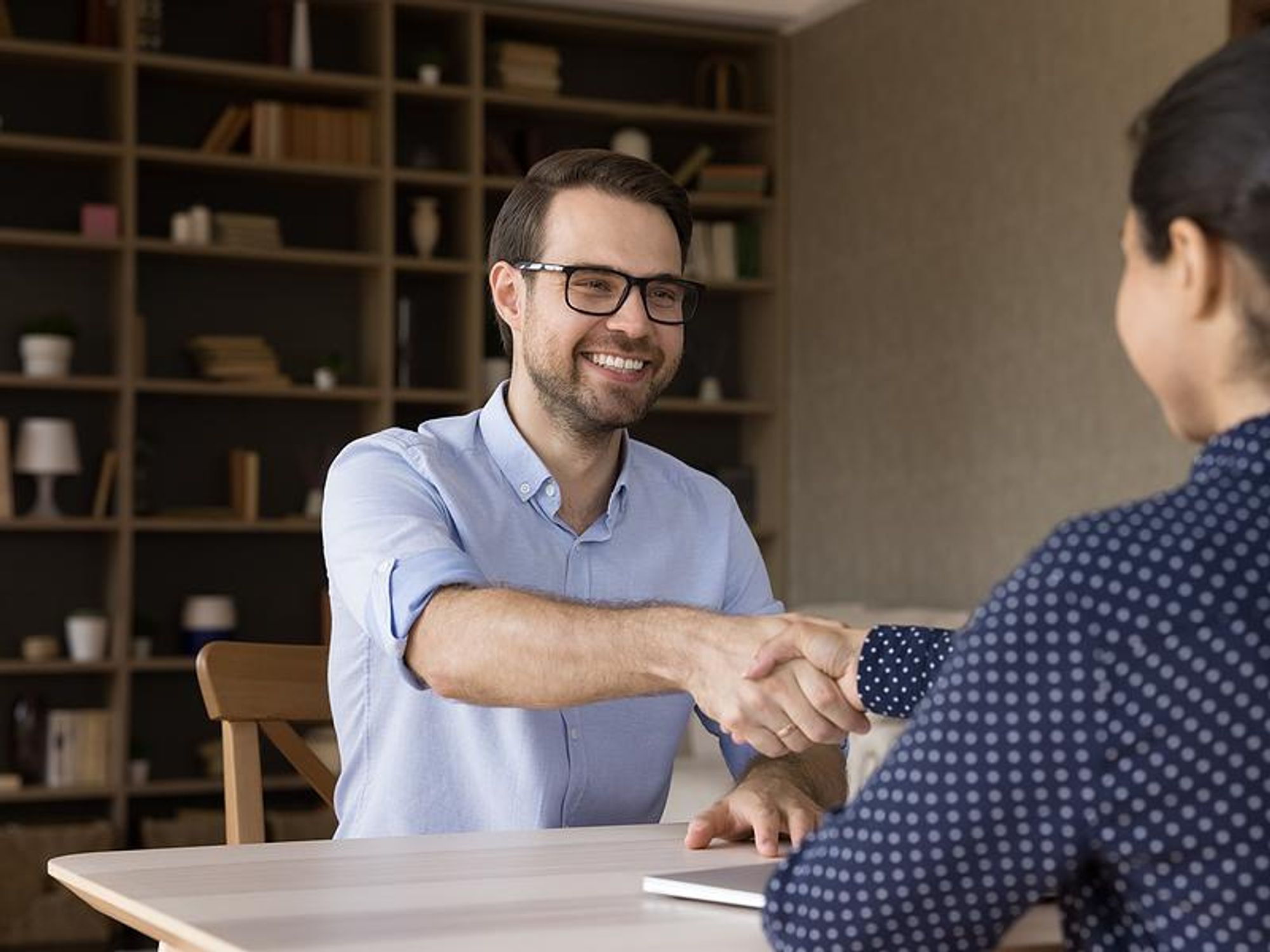 Man shakes the hiring manager's hand before a job interview