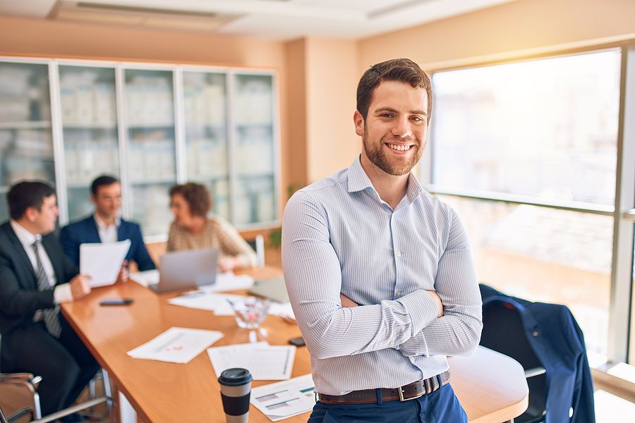 Man smiles after getting a promotion