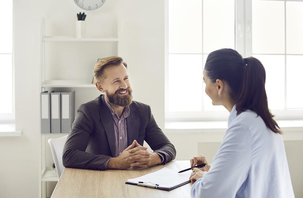 Man smiles during a job interview