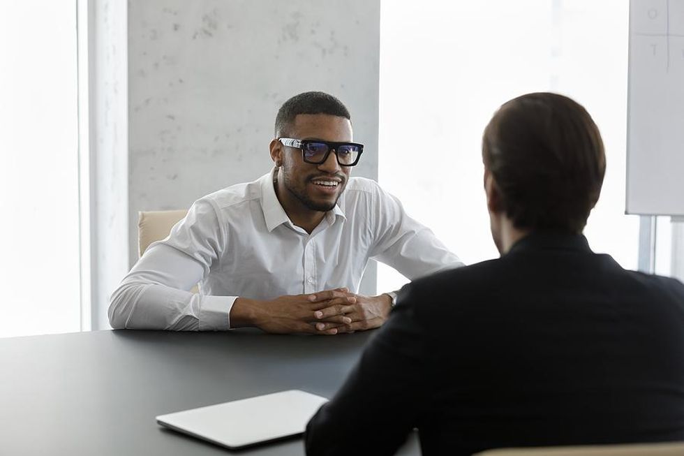 Man smiles during an interview