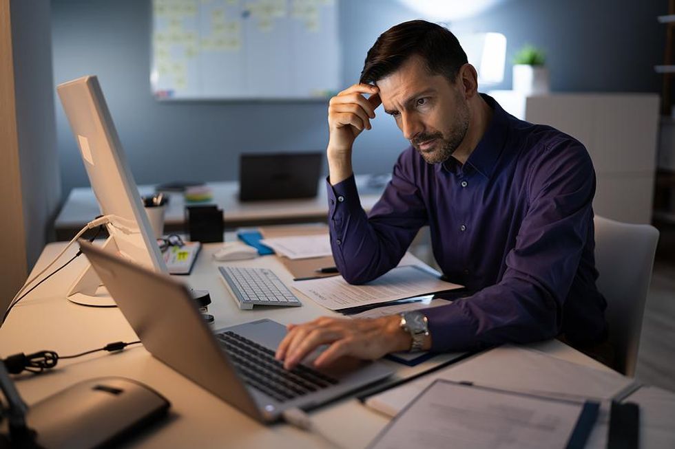 Man stressed about work during a recession