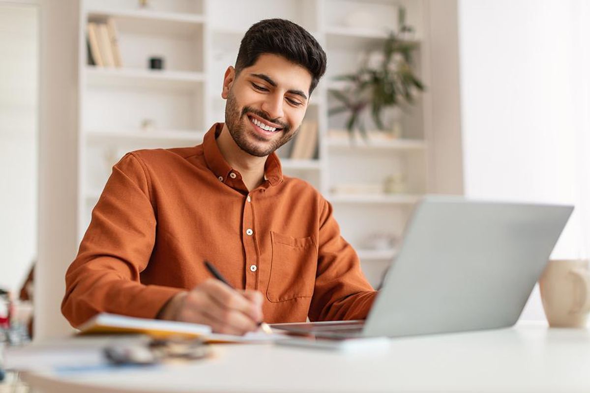 Man takes notes on how to fill out job applications
