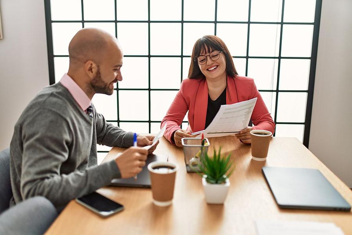 Man talks to his boss/coworker about his career goals