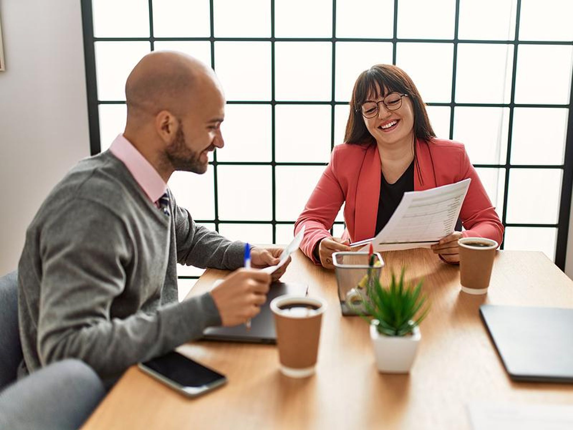 Man talks to his boss/coworker about his career goals