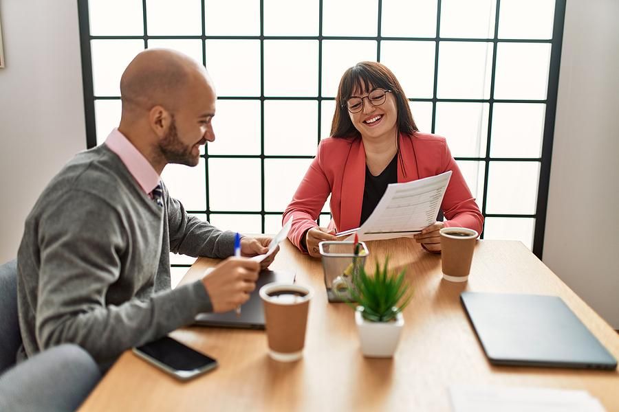Man talks to his boss/coworker about his career goals