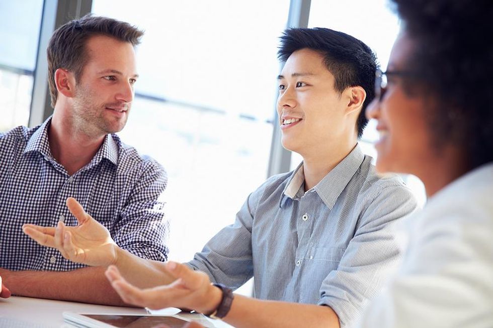 Man talks with people in his network during a meeting