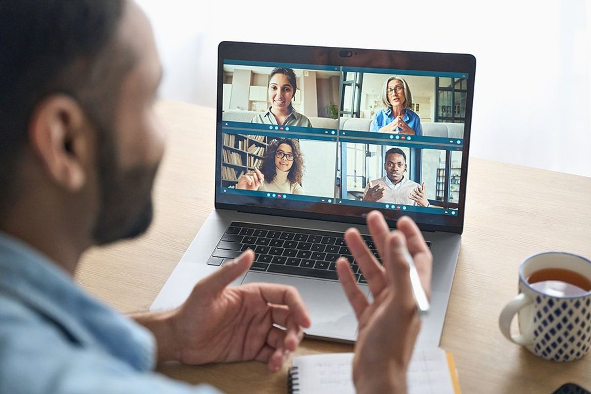 Man talks with some people in his network on a video call