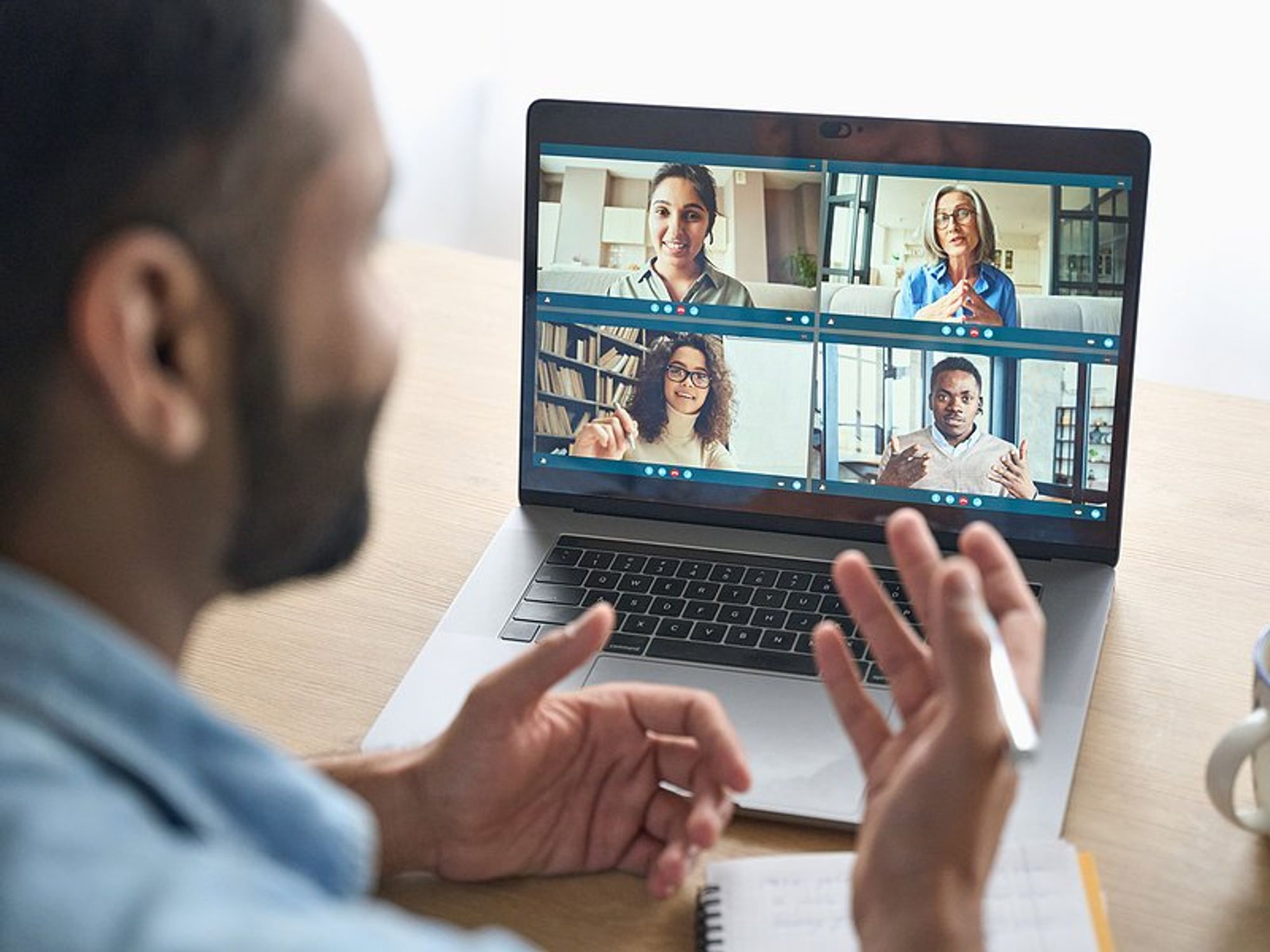 Man talks with some people in his network on a video call