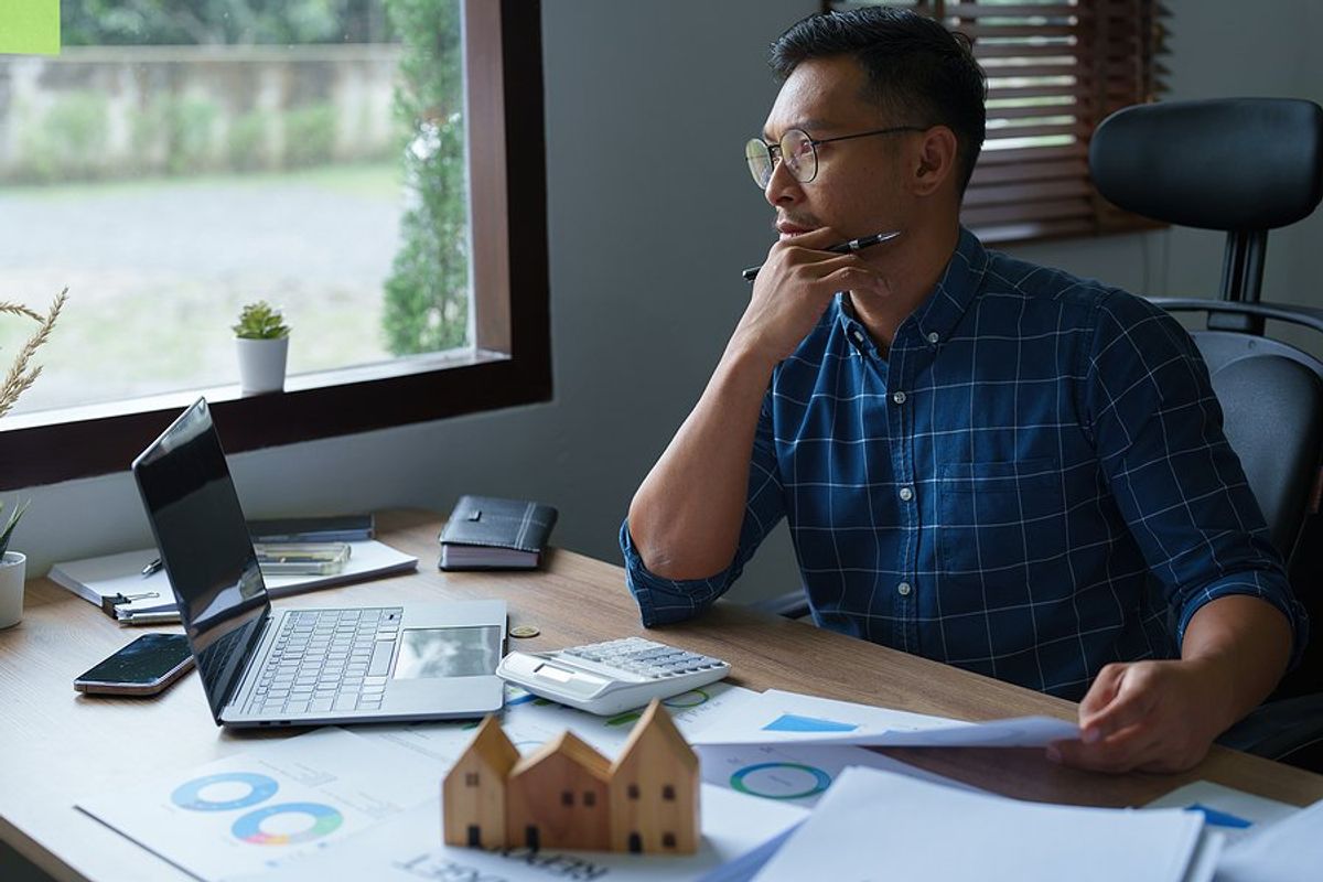 Man thinking about creating his first business budget