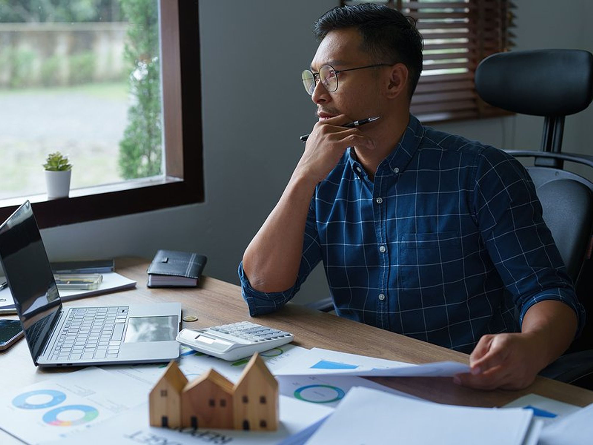Man thinking about creating his first business budget