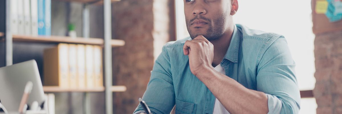 Man thinking about the doubts he has about his college degree