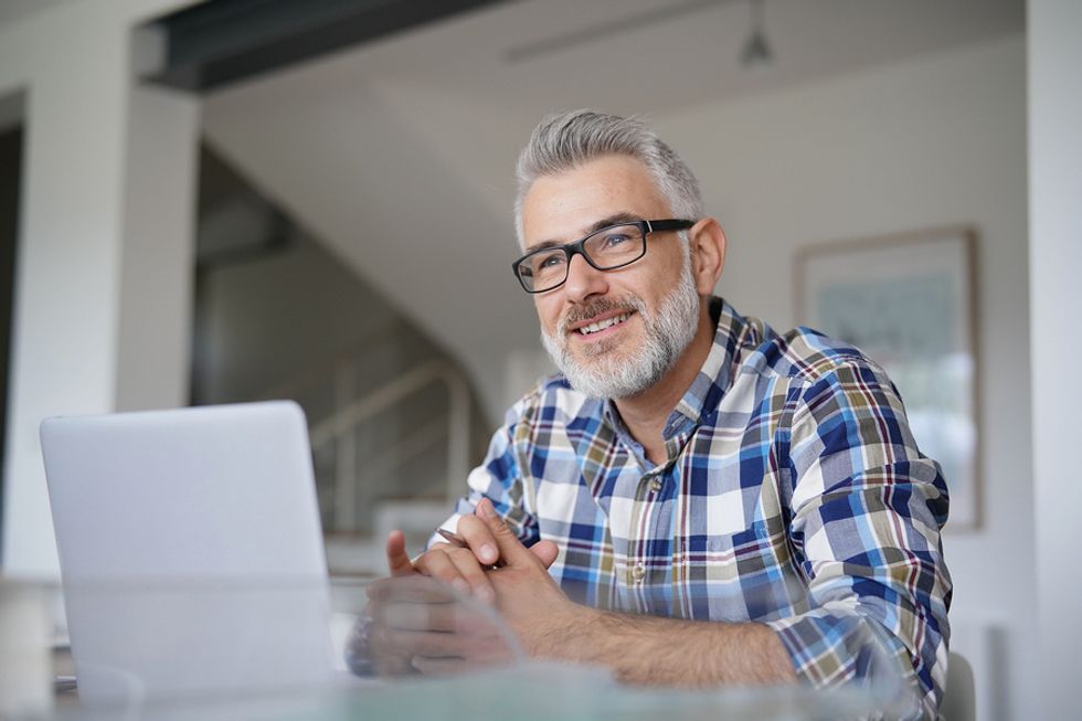 Man thinks about reaching out to people in the retail industry