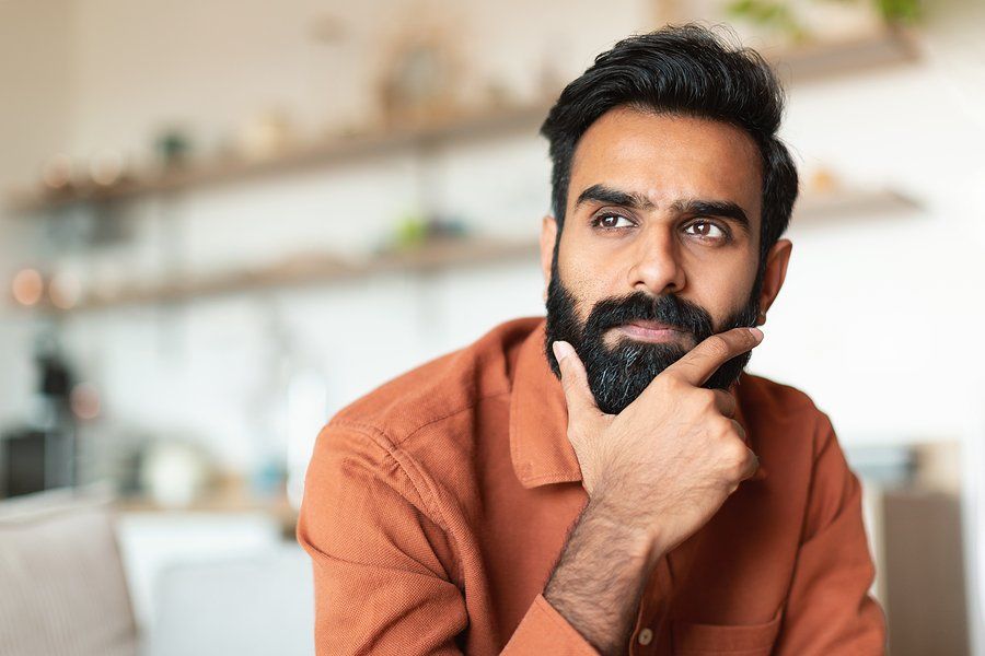 Man thinks about whether he should quit his job or not