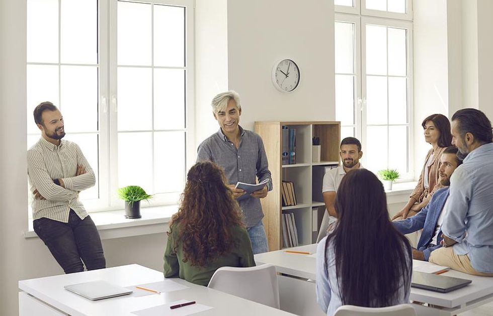 Man trains his employees a new technology