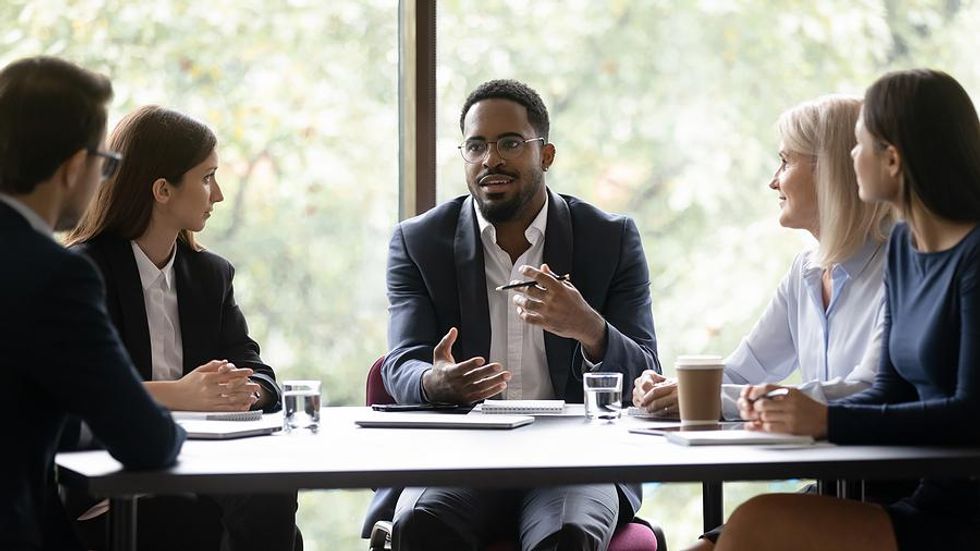 Man tries to be more assertive as he leads his team at work