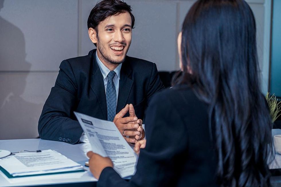 Man tries to beat the competition in a job interview