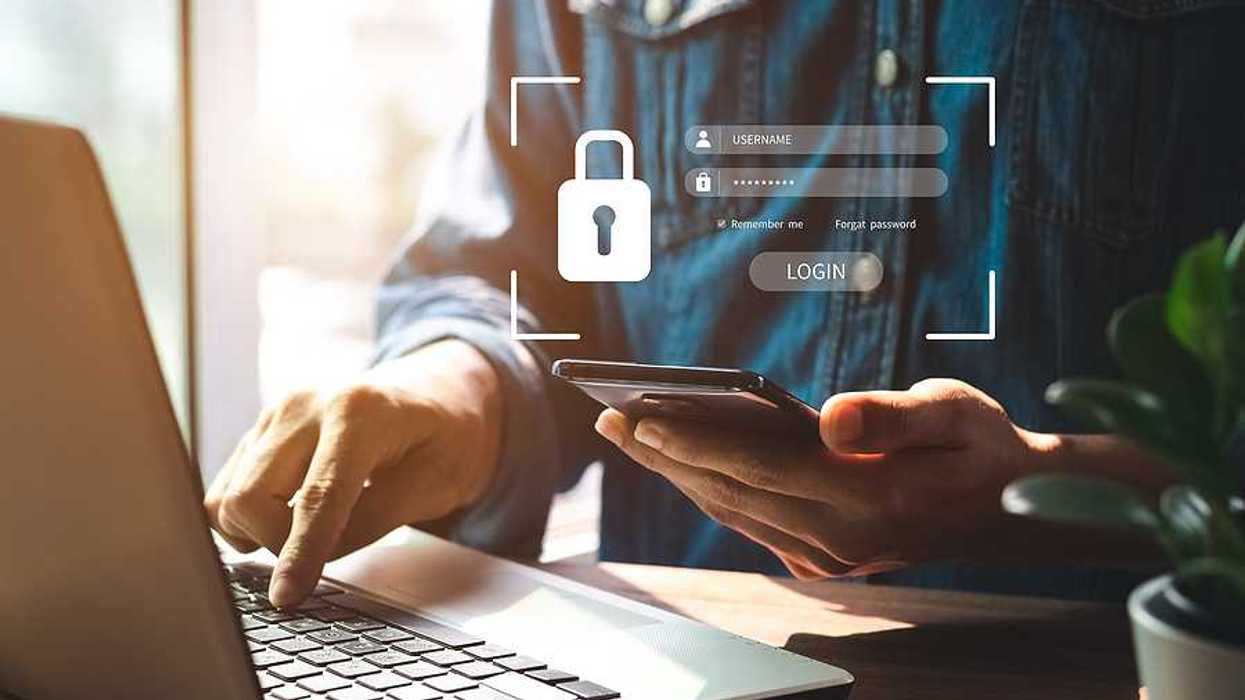 Man tries to log in to his laptop and phone, cybersecurity concept