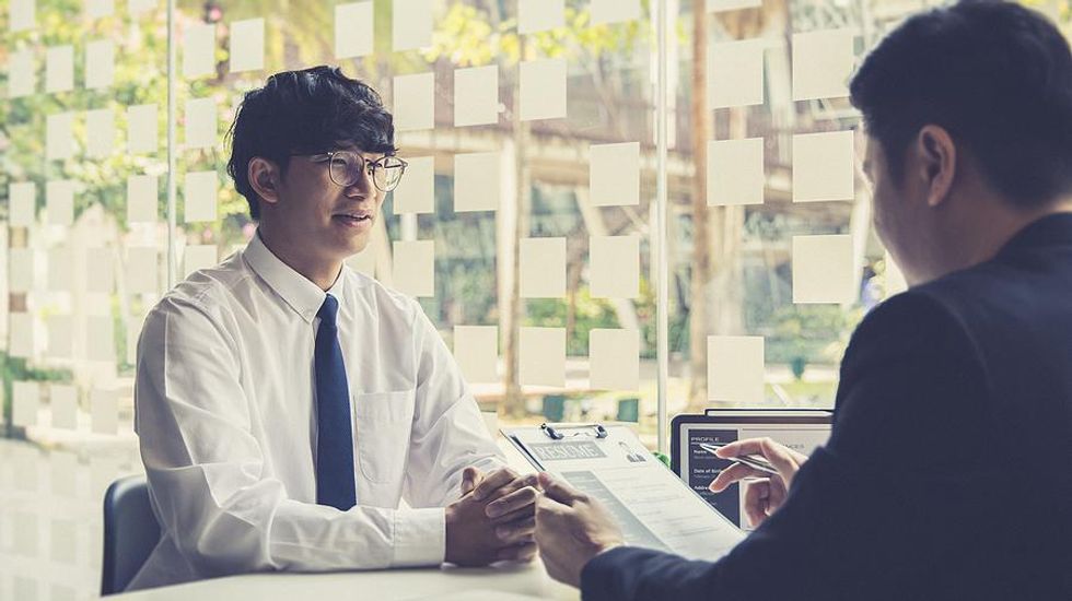 Man tries to stand out from the competition in a job interview