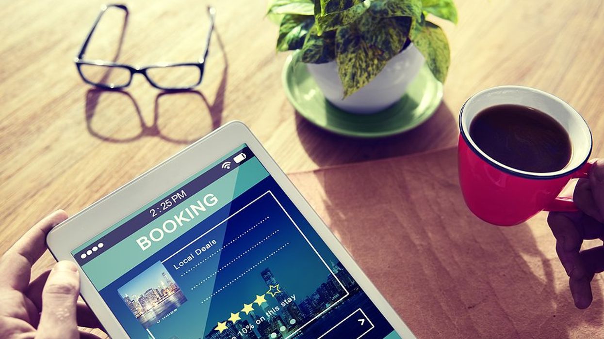 Man uses an SaaS hospitality app