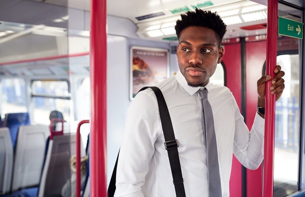 Man with a long commute to work thinks about accepting a new job offer