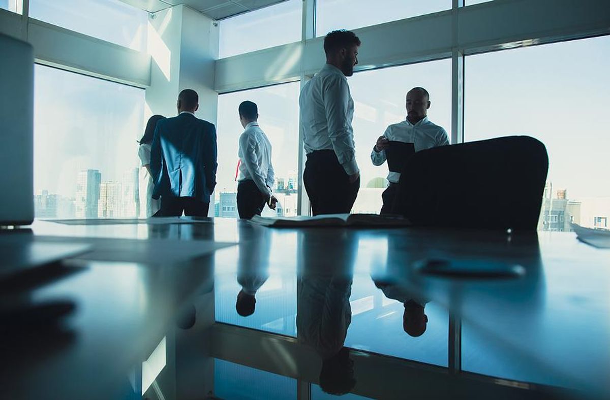 Man with autism tries to network during a work meeting