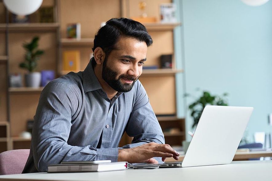 Man working for a company that pays for his vacation