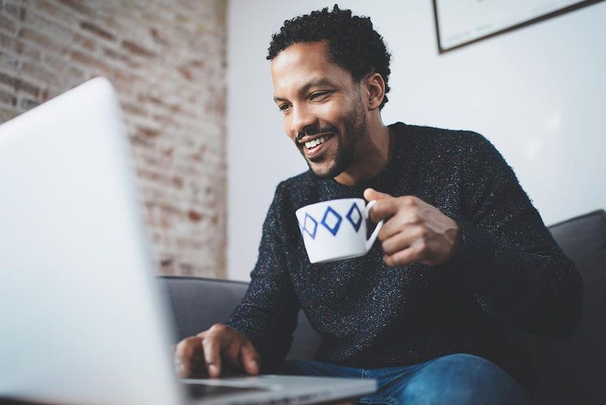 Man works from home for a company that pays for his vacation
