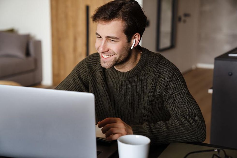 Man works from home for his job in the environmen