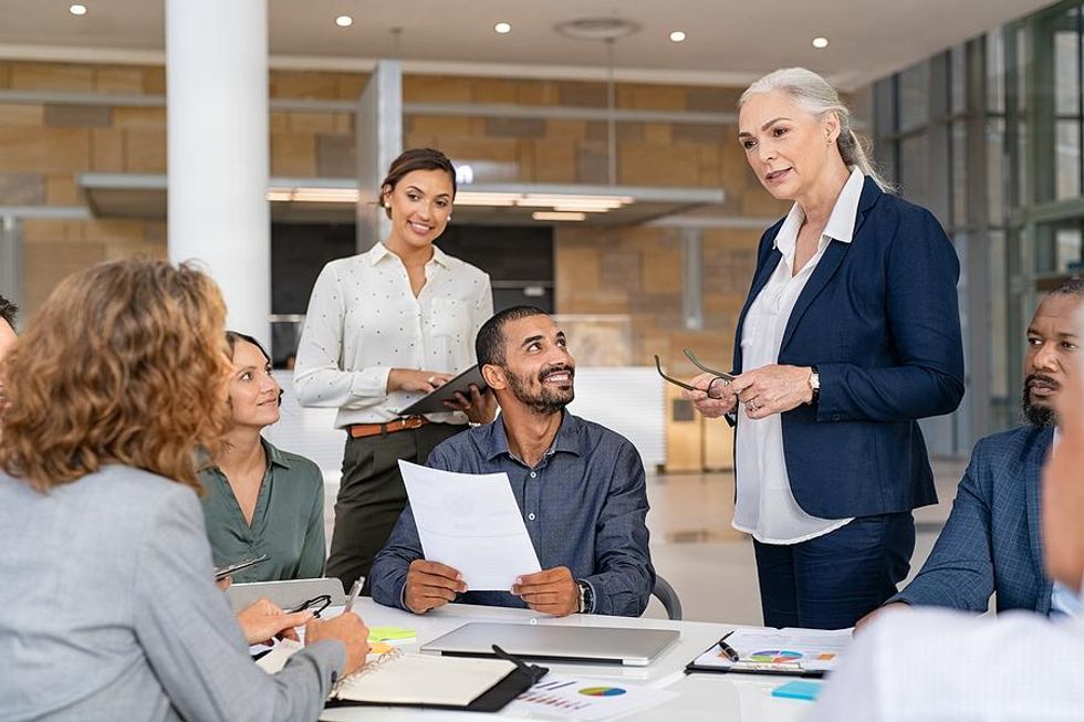 Manager talks to her team members