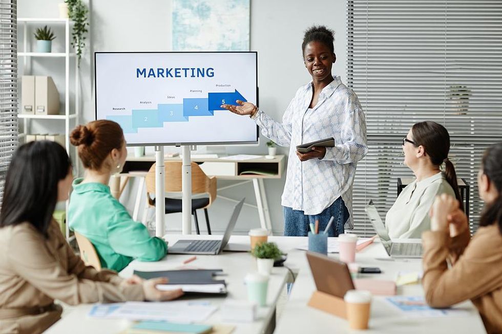 Marketing professional makes a presentation at work