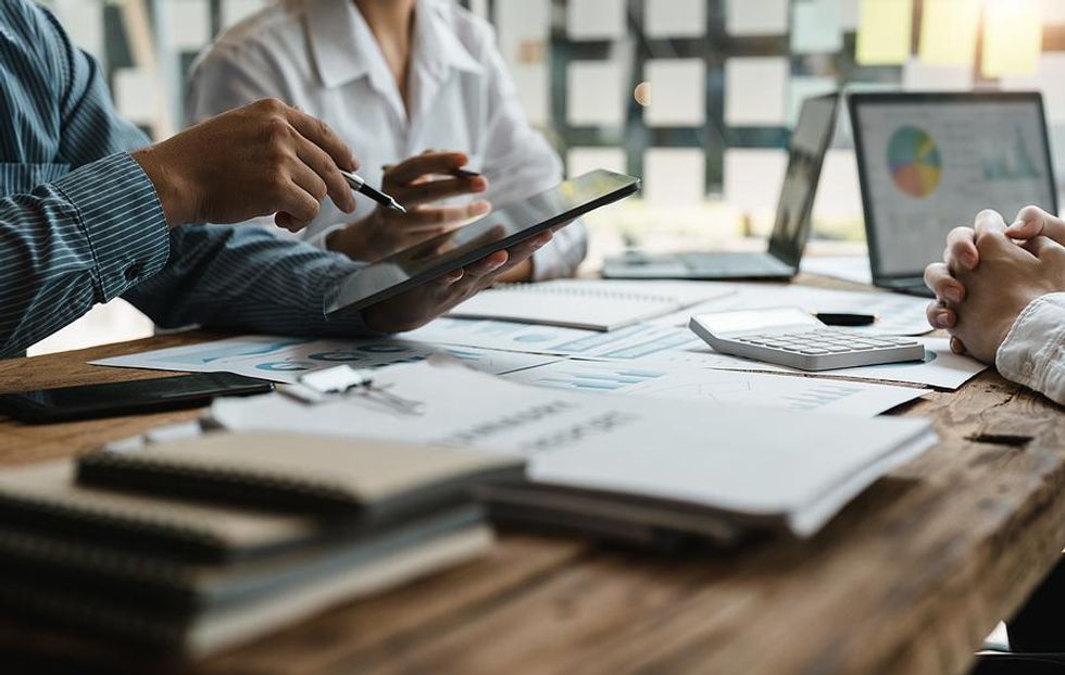 Marketing professional talks during a work meeting