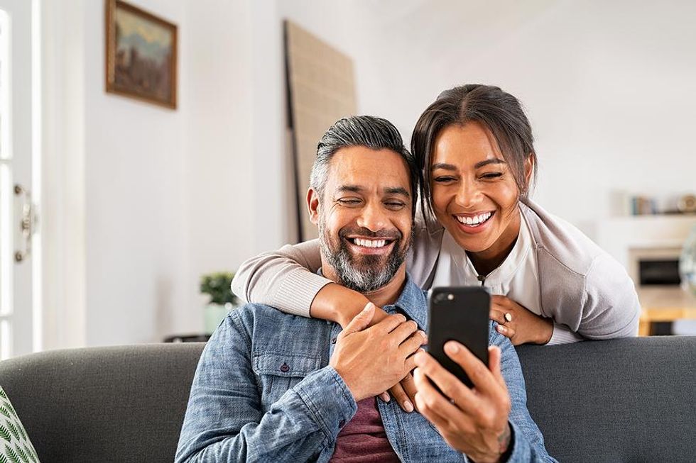 Married couple watches TikTok videos together