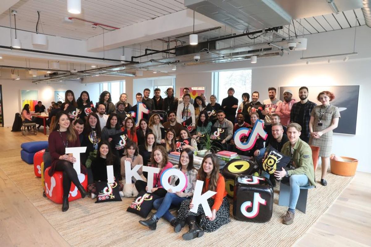 Members of the TikTok team pose for a photo.