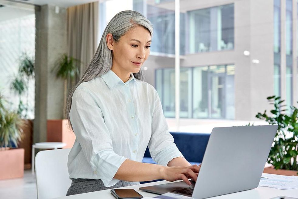 Middle aged woman researches how to change careers