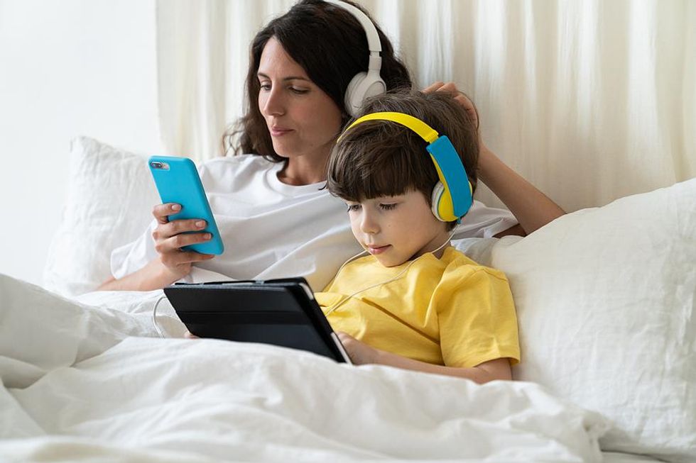 Mom and son listen to music together