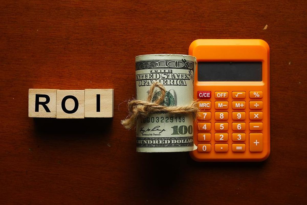 Money, calculator, ROI, return on investment concept