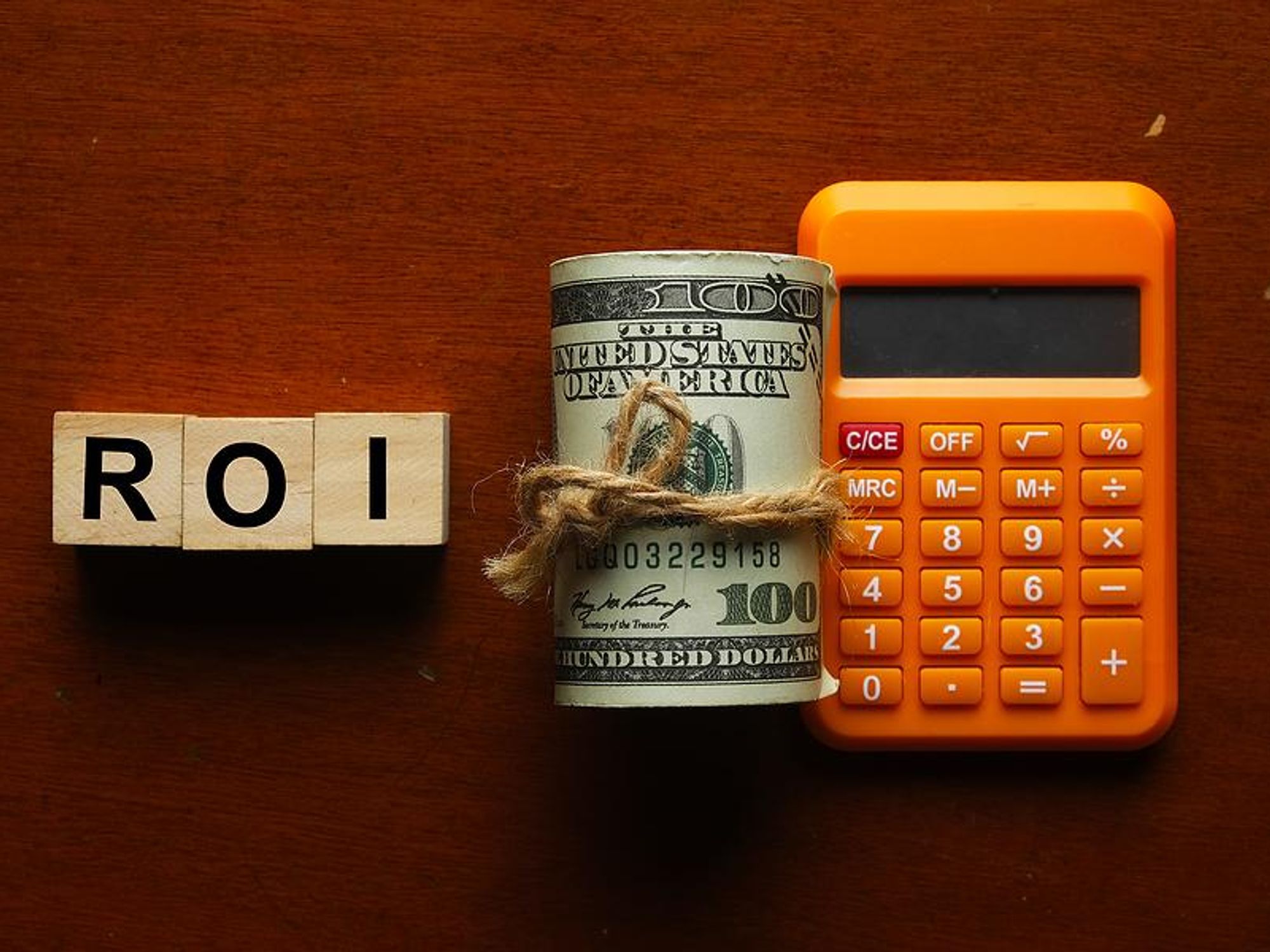 Money, calculator, ROI, return on investment concept