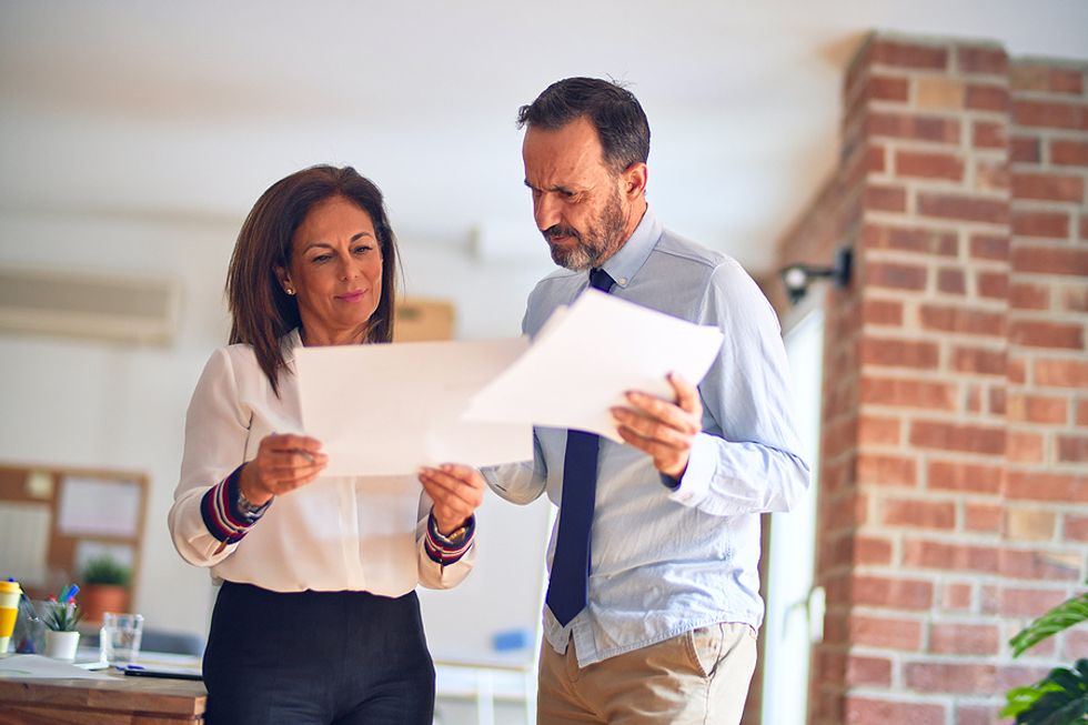 New manager compares notes with a colleague