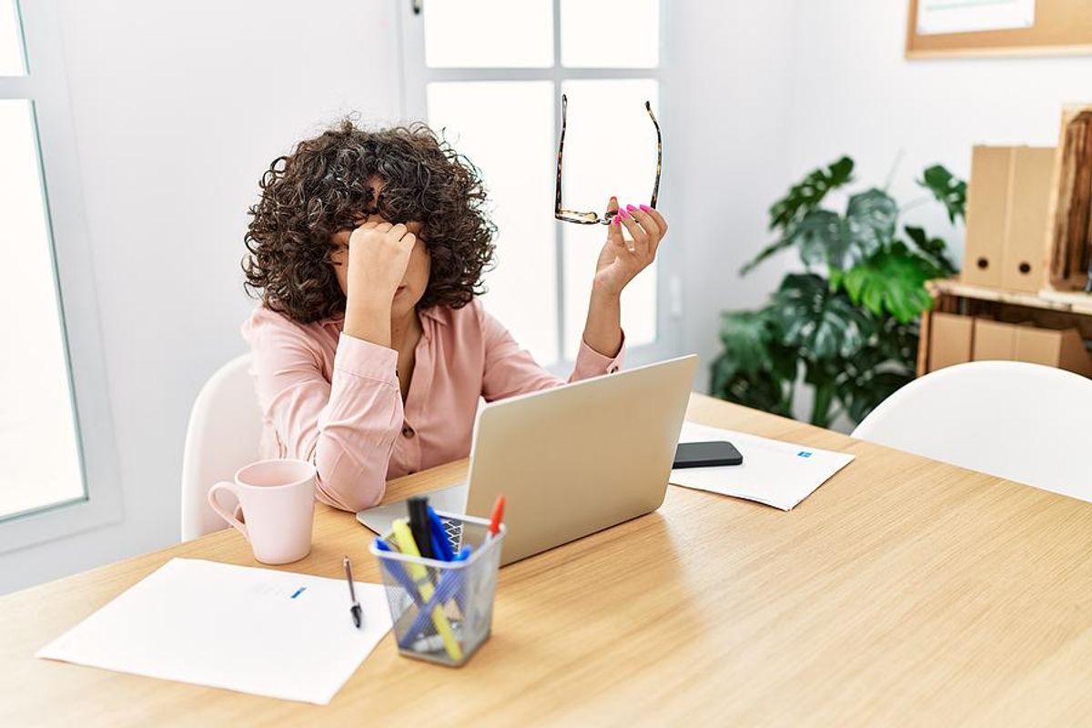 Overworked, burned out, stressed professional woman